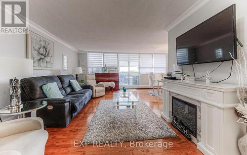 801 - 65 Westmount Road N, Waterloo, ON - Indoor Photo Showing Living Room With Fireplace