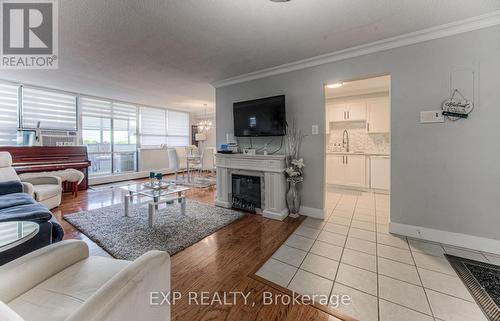 801 - 65 Westmount Road N, Waterloo, ON - Indoor Photo Showing Living Room With Fireplace