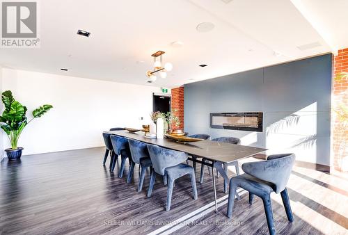 303 - 15 Wellington Street S, Kitchener, ON - Indoor Photo Showing Dining Room With Fireplace