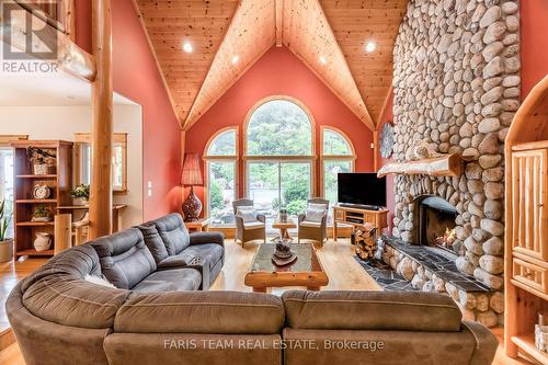 697 Lafontaine Road E, Tiny, ON - Indoor Photo Showing Living Room With Fireplace