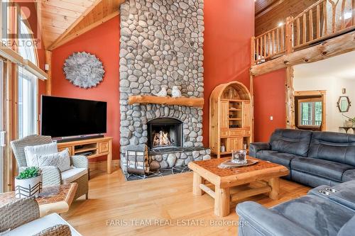 697 Lafontaine Road E, Tiny, ON - Indoor Photo Showing Living Room With Fireplace