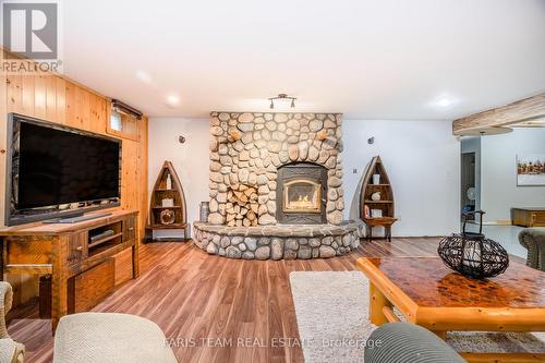 697 Lafontaine Road E, Tiny, ON - Indoor Photo Showing Living Room With Fireplace