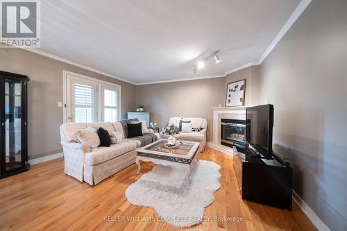 6 - 230 Meadowbrook Drive, Hamilton, ON - Indoor Photo Showing Living Room With Fireplace