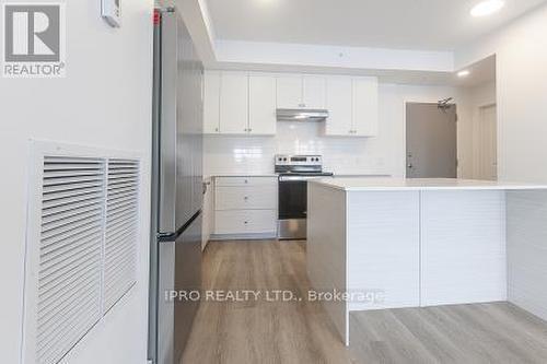 303 - 19B West Street N, Kawartha Lakes, ON - Indoor Photo Showing Kitchen With Stainless Steel Kitchen