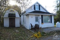 COZY 1 Bed + Den Detached Home Nestled at the Rear of the Lot - 