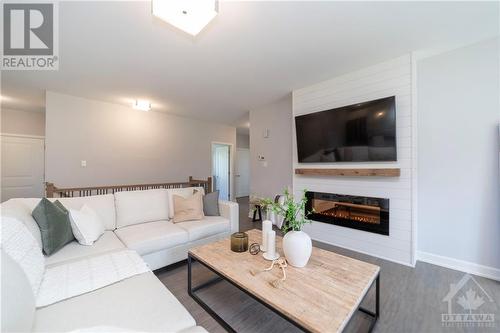 313 Moore Crescent, Kemptville, ON - Indoor Photo Showing Living Room With Fireplace