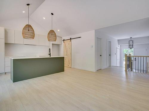 Overall view - 128 Rue Béatrice, Saint-Colomban, QC - Indoor Photo Showing Other Room With Fireplace