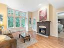 303-5660 Edgewater Lane, Nanaimo, BC  - Indoor Photo Showing Living Room With Fireplace 