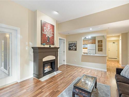 303-5660 Edgewater Lane, Nanaimo, BC - Indoor Photo Showing Living Room With Fireplace