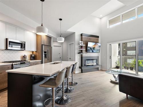 410-950 Whirlaway Cres, Langford, BC - Indoor Photo Showing Kitchen With Fireplace With Stainless Steel Kitchen With Upgraded Kitchen