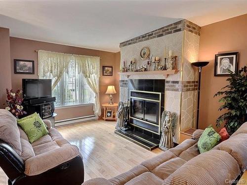 Salon - 294 Rue De La Lyre, L'Épiphanie, QC - Indoor Photo Showing Living Room With Fireplace