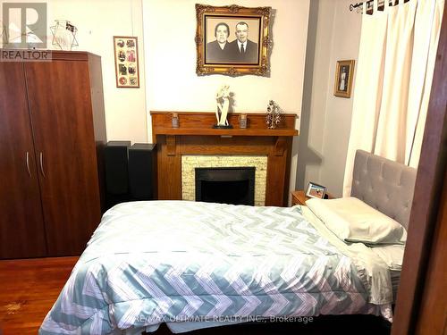 214 Perth Avenue, Toronto, ON - Indoor Photo Showing Bedroom With Fireplace