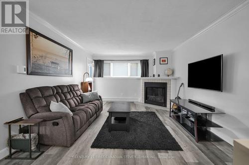 103 - 5 Jacksway Crescent, London, ON - Indoor Photo Showing Living Room With Fireplace