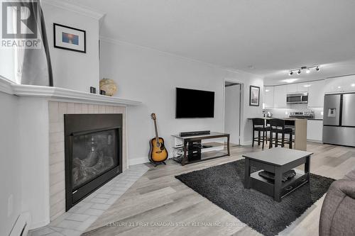 103 - 5 Jacksway Crescent, London, ON - Indoor Photo Showing Living Room With Fireplace