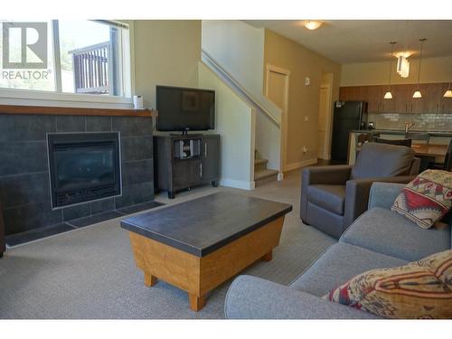 2049 Summit  Drive Unit# 314B, Panorama, BC - Indoor Photo Showing Living Room With Fireplace