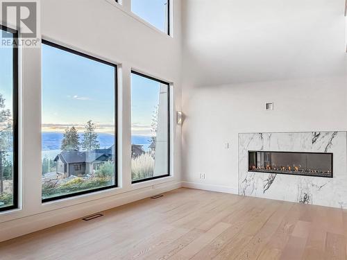 130 Flagstone Rise, Naramata, BC - Indoor Photo Showing Other Room With Fireplace