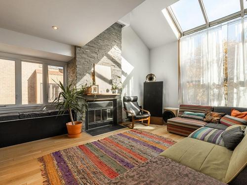 Living room - 586 Place Schumann, Brossard, QC - Indoor Photo Showing Other Room With Fireplace