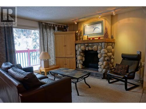 2030 Panorama Drive Unit# 1007, Panorama, BC - Indoor Photo Showing Living Room With Fireplace