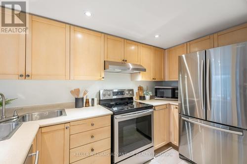 #105 - 50 Merchant Lane, Toronto, ON - Indoor Photo Showing Kitchen With Double Sink