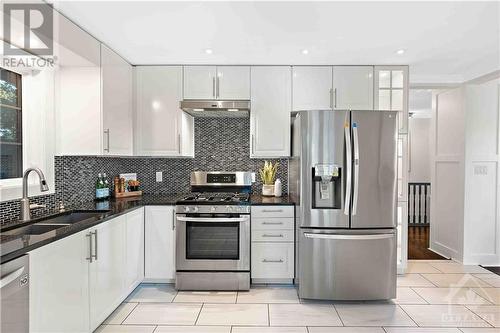 New Cupboards, Backsplash & Brand New SS Refrigerator & Dishwasher - 3027 Prince Of Wales Drive, Ottawa, ON - Indoor Photo Showing Kitchen With Double Sink With Upgraded Kitchen