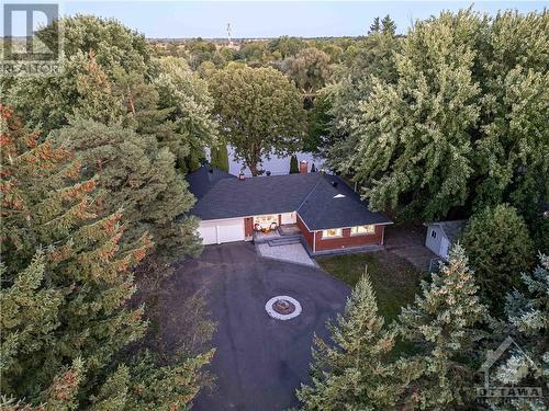 Mature trees surround the property giving an overall sense of privacy and serenity - 3027 Prince Of Wales Drive, Ottawa, ON - Outdoor With View