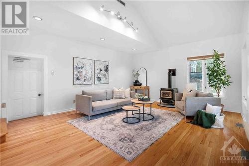 Sunken Family Room with Inside Entry to Double Car Garage - 3027 Prince Of Wales Drive, Ottawa, ON - Indoor Photo Showing Living Room