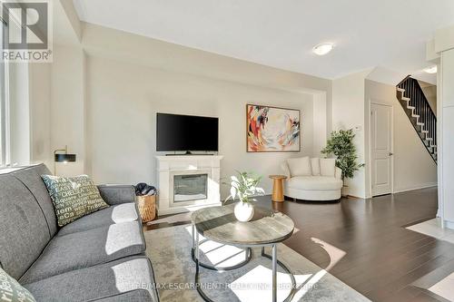 7 Freedom Crescent, Hamilton, ON - Indoor Photo Showing Living Room With Fireplace