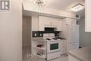 404 - 4 Elsinore Path, Toronto, ON  - Indoor Photo Showing Kitchen 