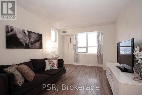 404 - 4 Elsinore Path, Toronto, ON - Indoor Photo Showing Living Room