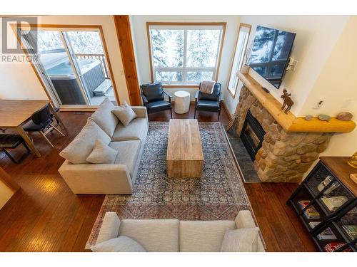 5423 Boomerang Way Unit# 36, Fernie, BC - Indoor Photo Showing Living Room With Fireplace