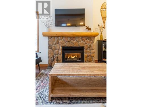 5423 Boomerang Way Unit# 36, Fernie, BC - Indoor Photo Showing Living Room With Fireplace