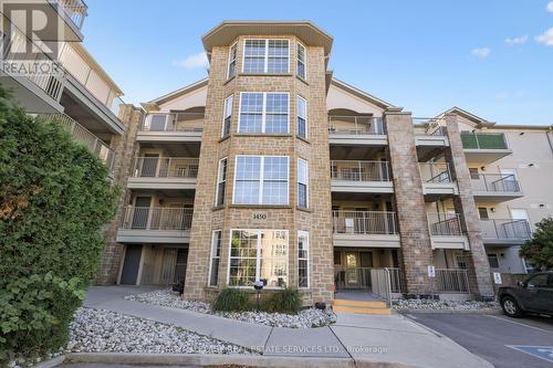 211 - 1450 Bishops Gate, Oakville, ON - Outdoor With Balcony With Facade