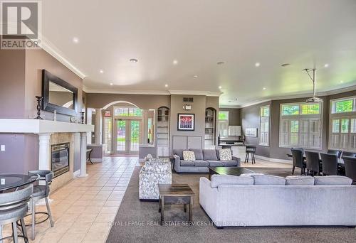 211 - 1450 Bishops Gate, Oakville, ON - Indoor Photo Showing Living Room With Fireplace