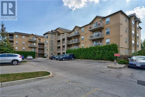 211 - 1450 Bishops Gate, Oakville, ON - Outdoor With Balcony With Facade