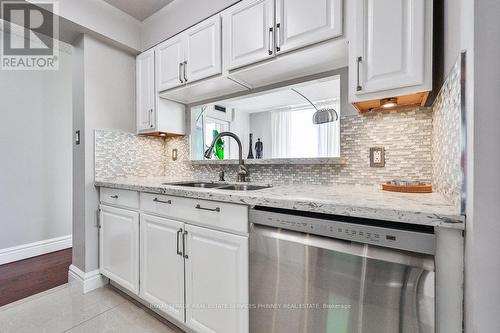 708 - 1 Hickory Tree Road, Toronto, ON - Indoor Photo Showing Kitchen With Double Sink With Upgraded Kitchen