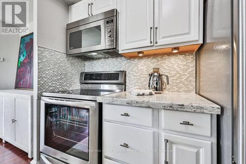 708 - 1 Hickory Tree Road, Toronto, ON - Indoor Photo Showing Kitchen With Upgraded Kitchen