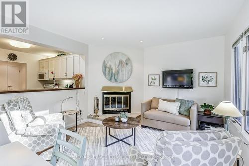 69 Sonneck Square, Toronto, ON - Indoor Photo Showing Living Room With Fireplace