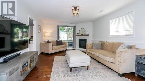 99 Churchland Drive, Barrie, ON - Indoor Photo Showing Living Room With Fireplace