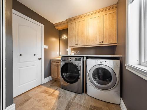 Salle de lavage - 156 Rue Jean-De Fonblanche, Carignan, QC - Indoor Photo Showing Laundry Room