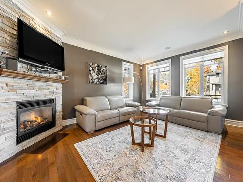 Salon - 156 Rue Jean-De Fonblanche, Carignan, QC - Indoor Photo Showing Living Room With Fireplace