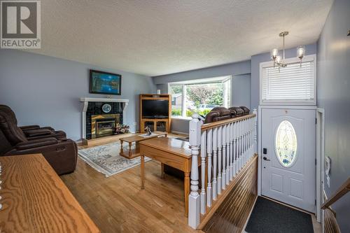 7713 Thompson Drive, Prince George, BC - Indoor Photo Showing Living Room With Fireplace