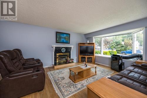 7713 Thompson Drive, Prince George, BC - Indoor Photo Showing Living Room With Fireplace