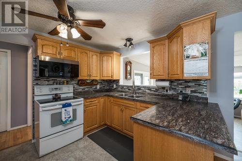 7713 Thompson Drive, Prince George, BC - Indoor Photo Showing Kitchen With Double Sink