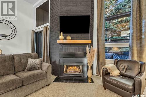 7 455 Pinehouse Drive, Saskatoon, SK - Indoor Photo Showing Living Room With Fireplace