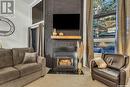 7 455 Pinehouse Drive, Saskatoon, SK  - Indoor Photo Showing Living Room With Fireplace 