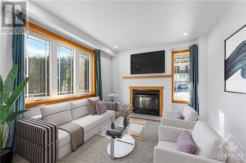 Virtually Staged - 366 Pickford Drive, Ottawa, ON - Indoor Photo Showing Living Room With Fireplace