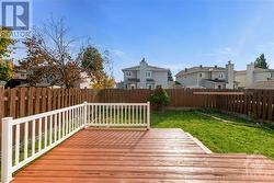 Large deck with railing in back yard perfect for barbecues and outdoor entertaining - 