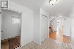 Front foyer with garage and laundry to left, kitchen and living room to right - 