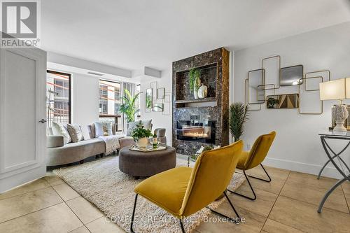 208 - 500 Glencairn Avenue, Toronto, ON - Indoor Photo Showing Living Room With Fireplace