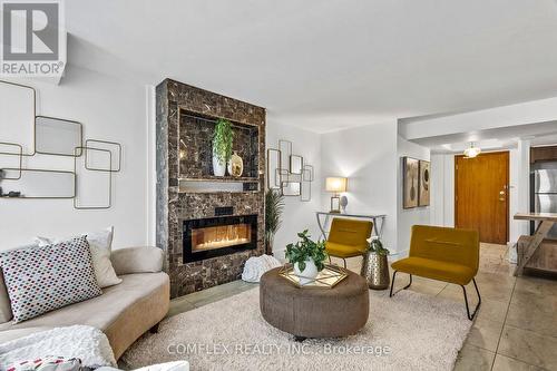 208 - 500 Glencairn Avenue, Toronto, ON - Indoor Photo Showing Living Room With Fireplace